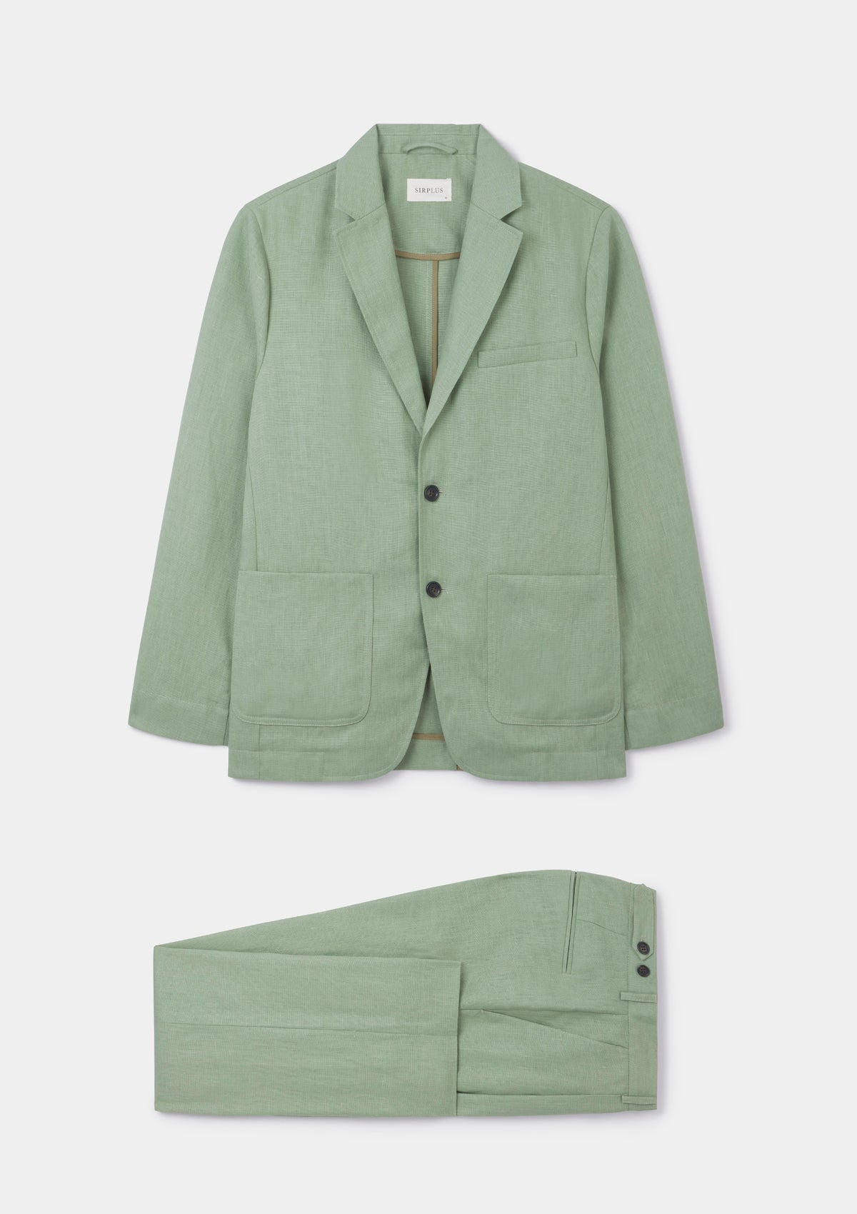 A pale green pure linen suit with an unlined blazer and pleated trousers, shown on a model.