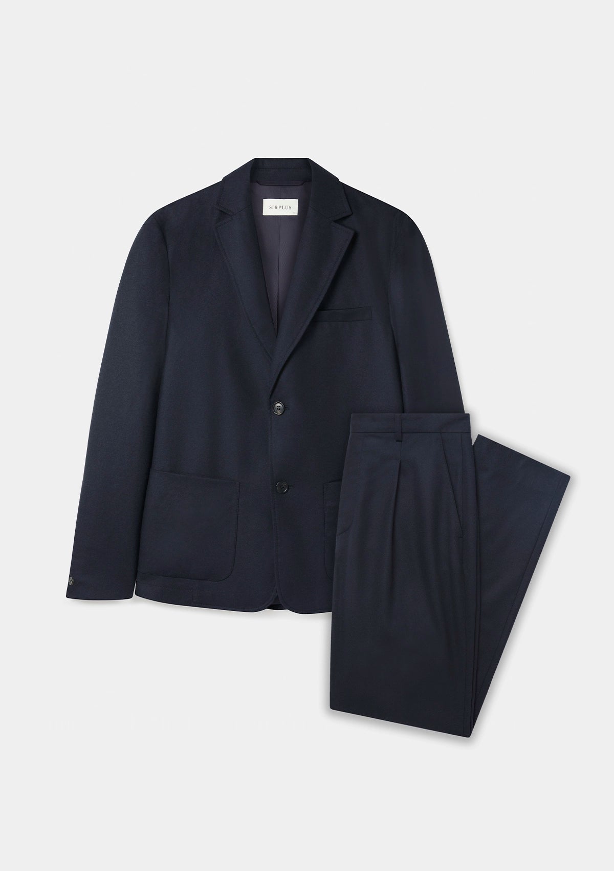 A navy unstructured suit in a wool and cashmere mix with pleated trousers, shown on a model.